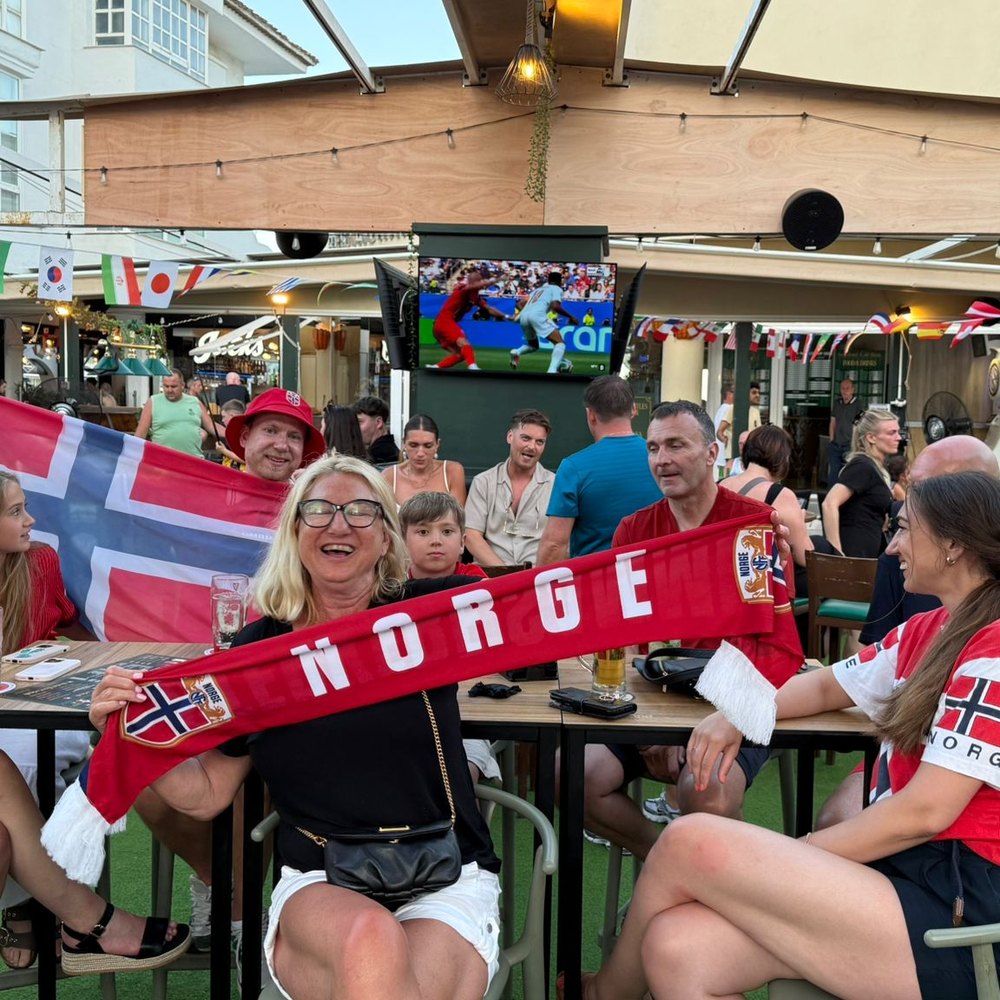 Fans with scarves up at MT Pockets at MT Pockets, Puerto Marina Benalm&aacute;dena