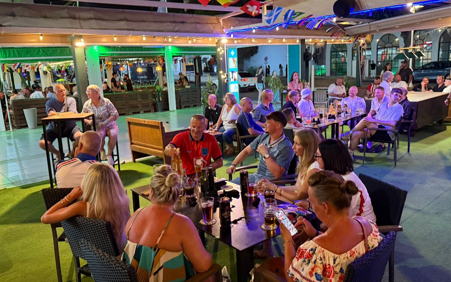 Matchday crowd on the terrace, big screens on at MT Pockets, Puerto Marina Benalm&aacute;dena